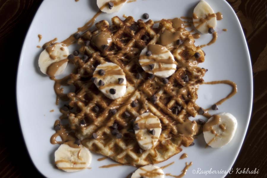 Waffle topped with peanut butter and bananas.