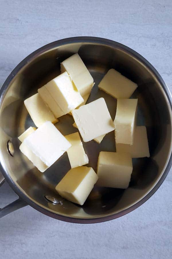 Cubed butter in a sauce pan.