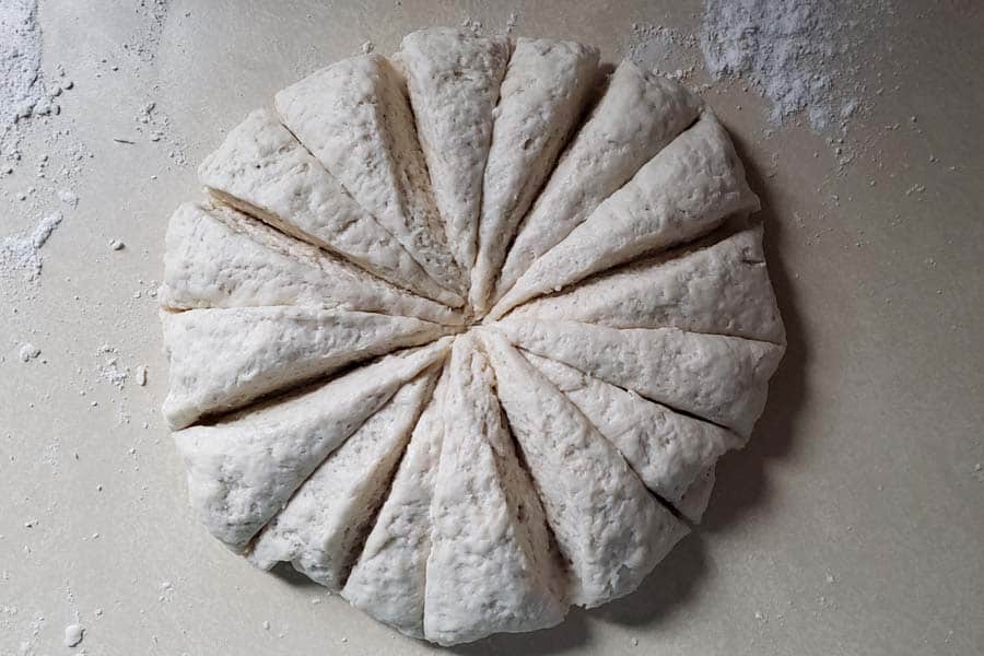 Sourdough flour tortilla dough cut into equal portions.