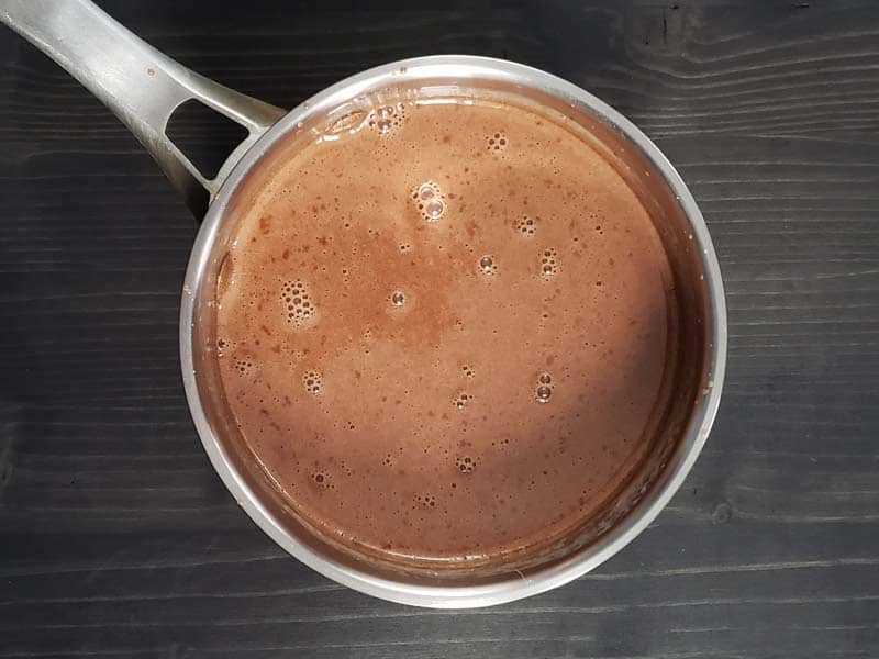 Cream and Nutella in a sauce pan.