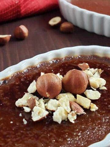 close up of nutella creme brulee topped with chopped hazelnuts
