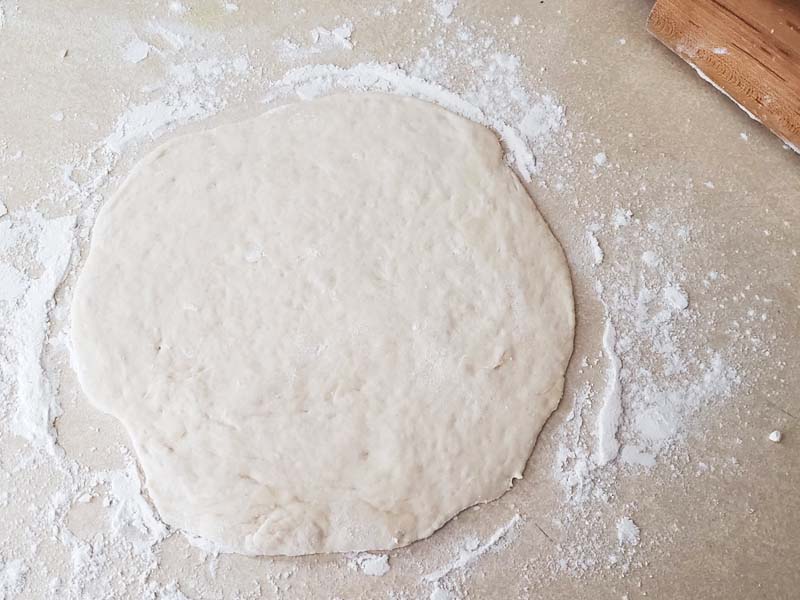 Pita bread rolled into six inch circle.