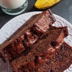 Three slices of sourdough chocolate banana bread on a white plate.