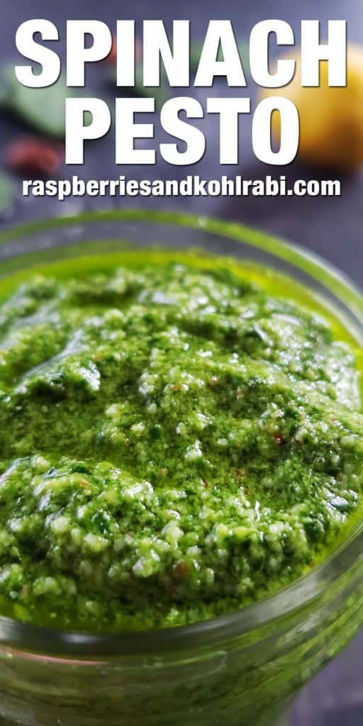 close up of spinach pesto in a glass jar