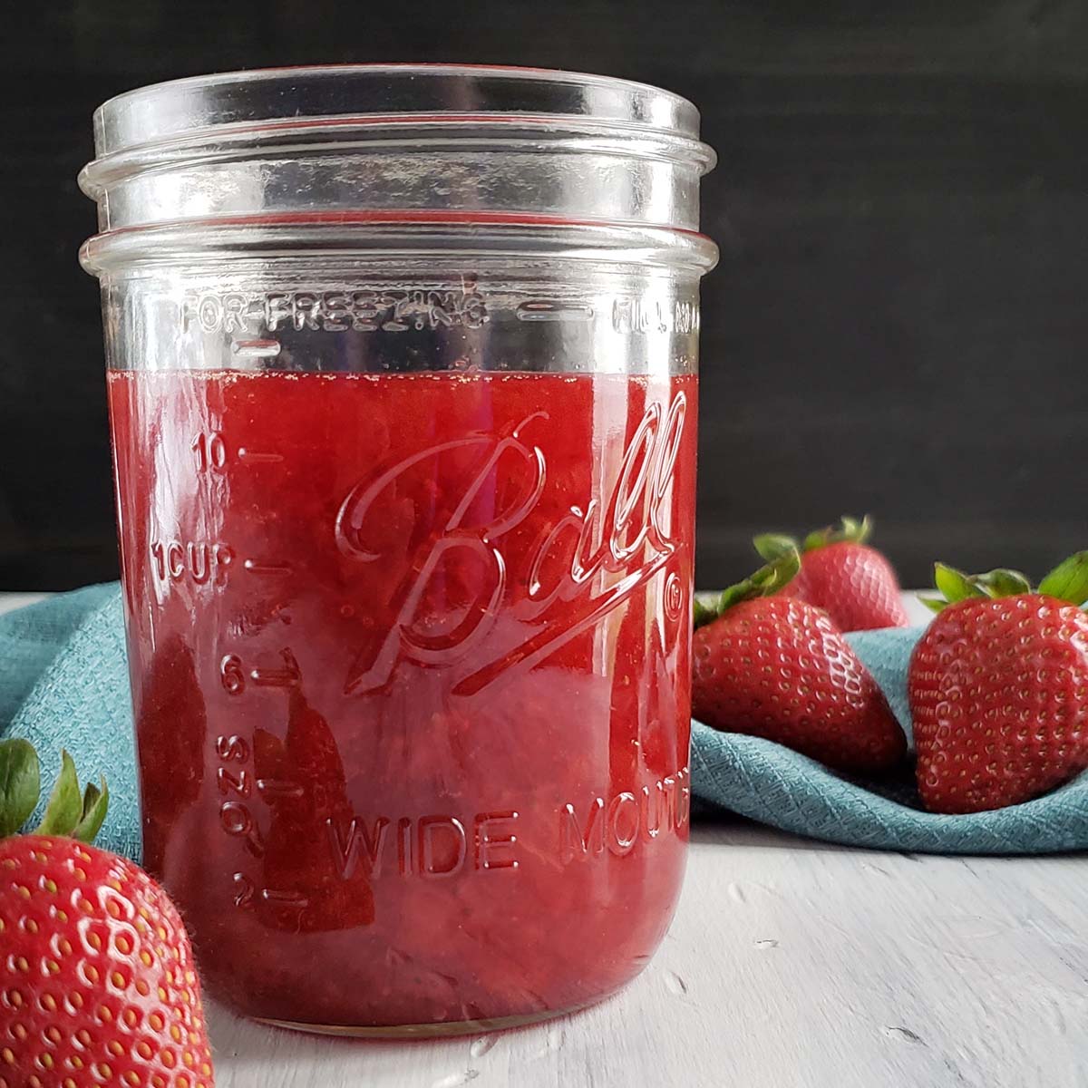Strawberry lemon syrup in a glass jar.