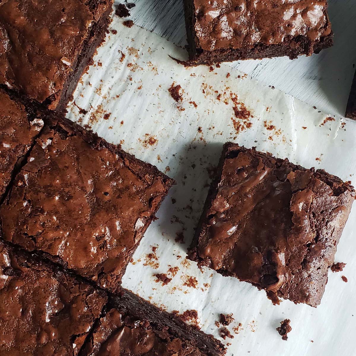 sliced fresh mint brownies on a white surface
