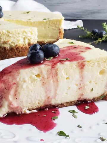 slice of lemon thyme cheesecake on a white plate