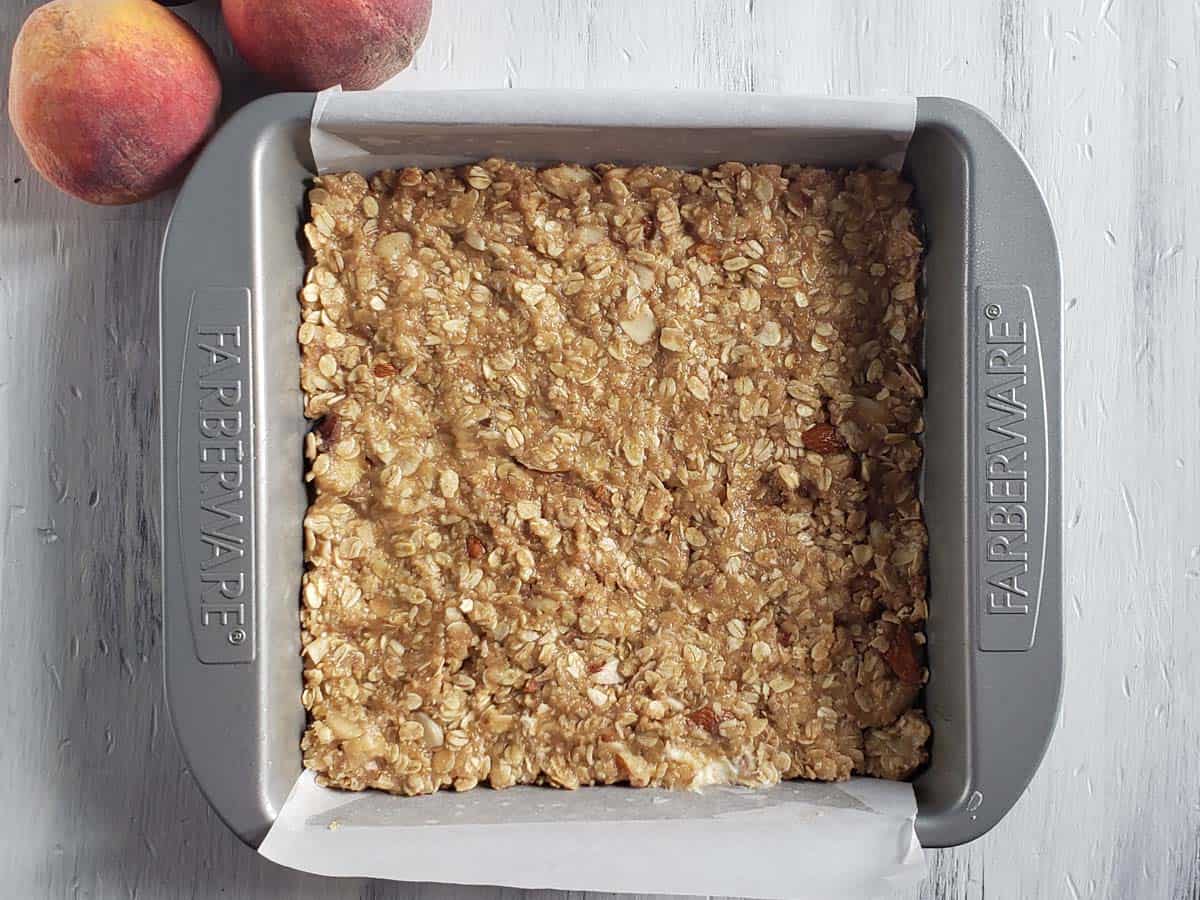 Unbaked oatmeal crust in a baking pan.