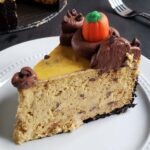 slice of pumpkin cheesecake on a white plate