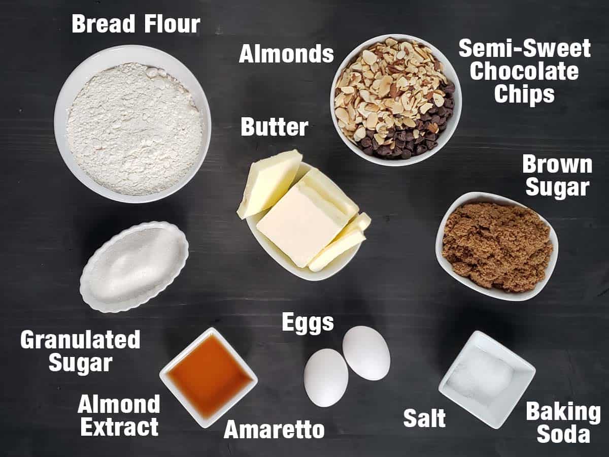 amaretto chocolate chip cookie ingredients on a dark background