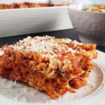 slice of lasagna on a white plate