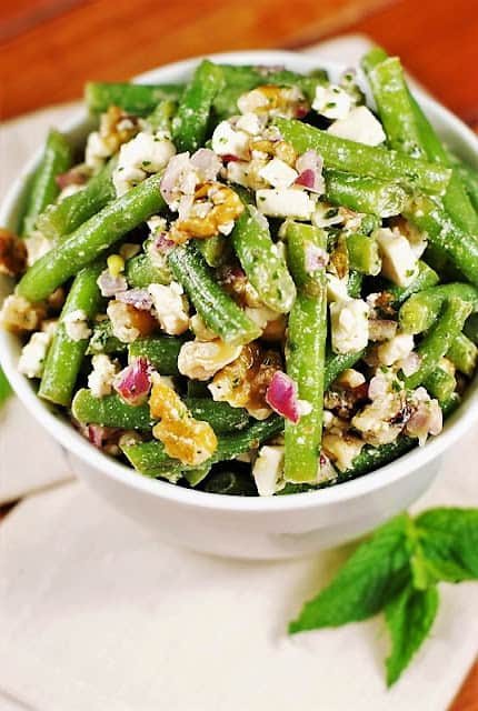 fresh green bean salad in a white bowl