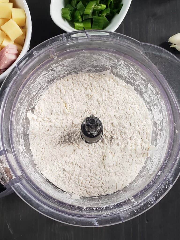 Flour and butter in a food processor.