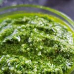 Spinach pesto in a glass jar.