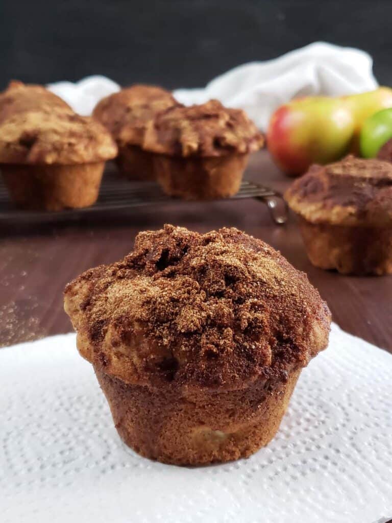 Sourdough apple cinnamon muffin on a white napkin.