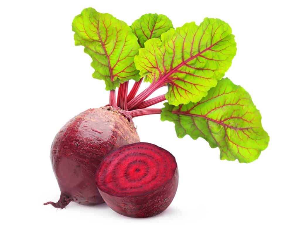 Fresh beetroot with leaves isolated on white