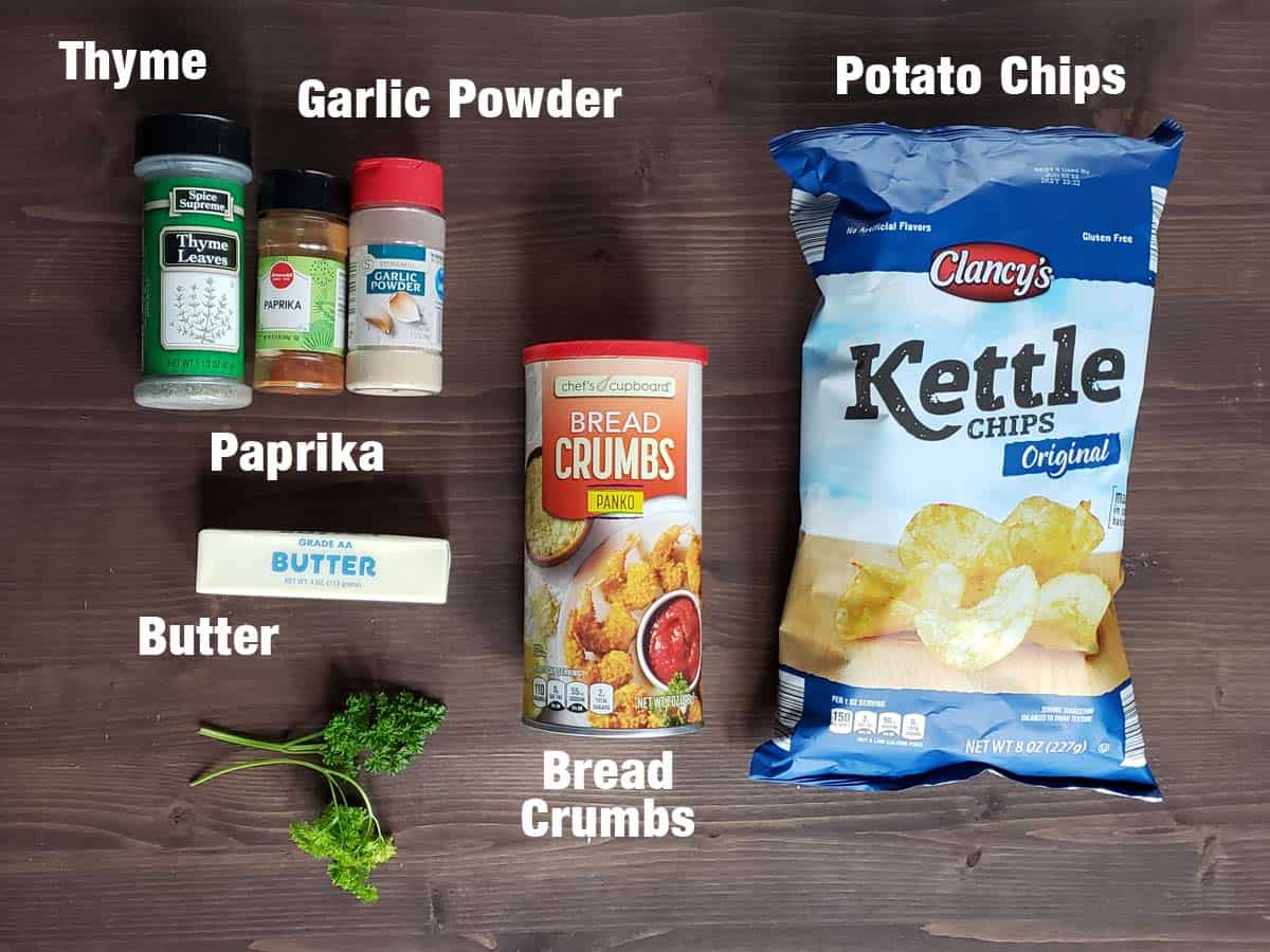 Potato chip topping ingredients on a dark wood background.