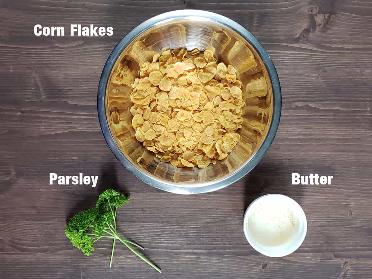 Corn flake topping ingredients on a wood surface.