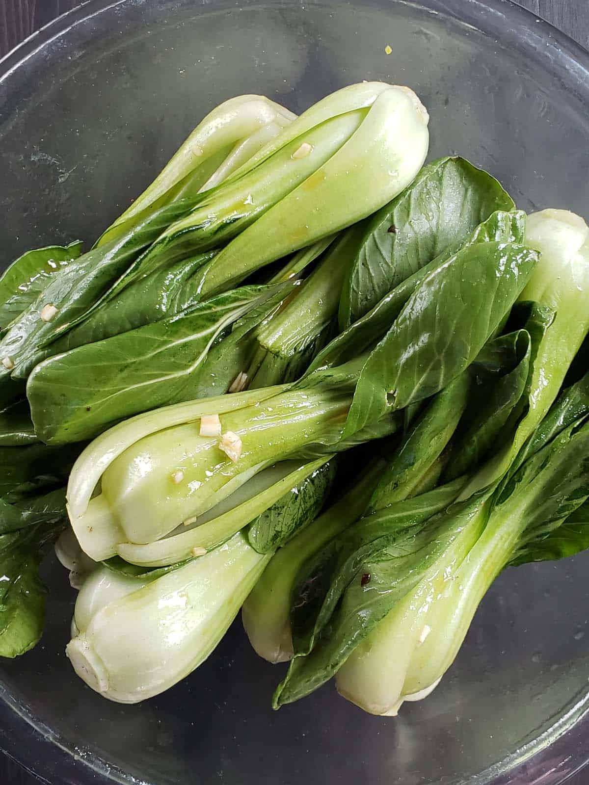 Baby bok choy in a glass bowl.
