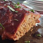 Meatloaf on a metal baking pan.