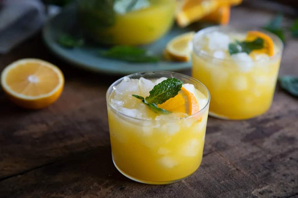 Citrus mint punch in short glasses.