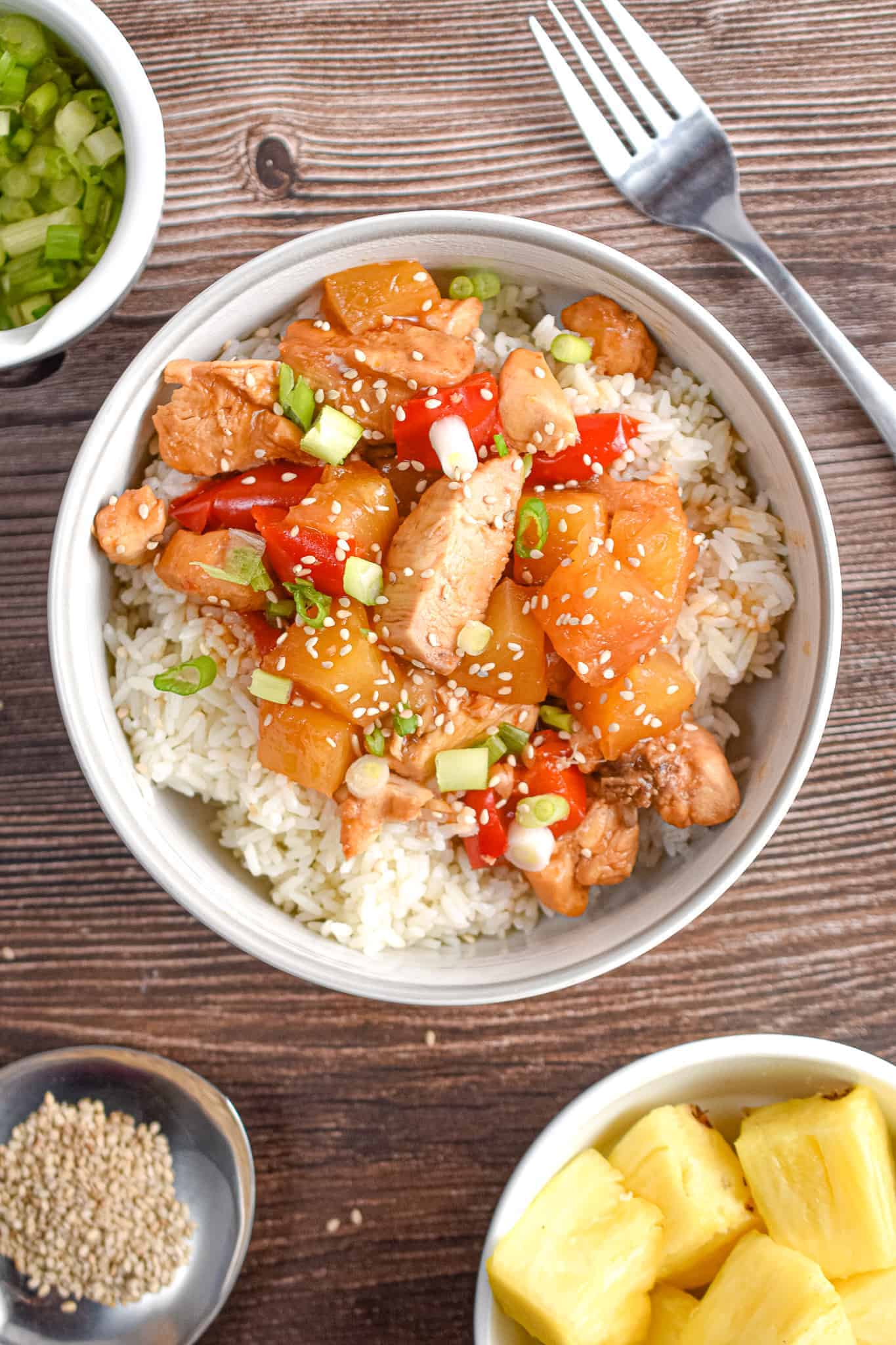 Hawaiian chicken and rice in a white bowl.
