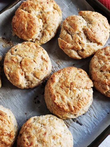 Close up of sourdough scones on a baking tray.