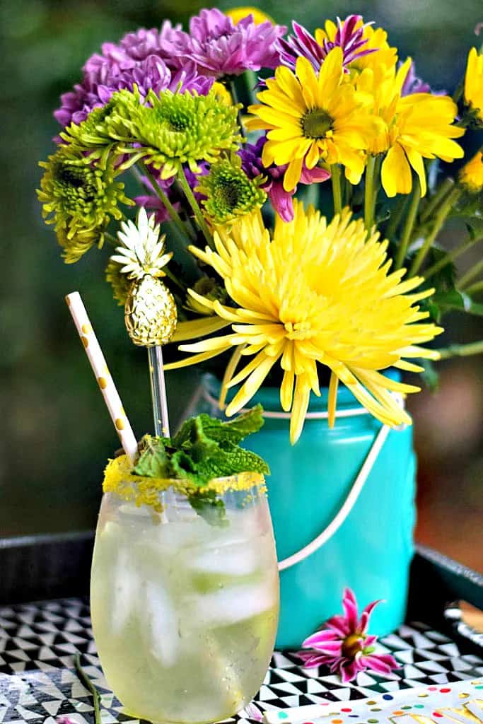 Mint pineapple spritzer in a glass.