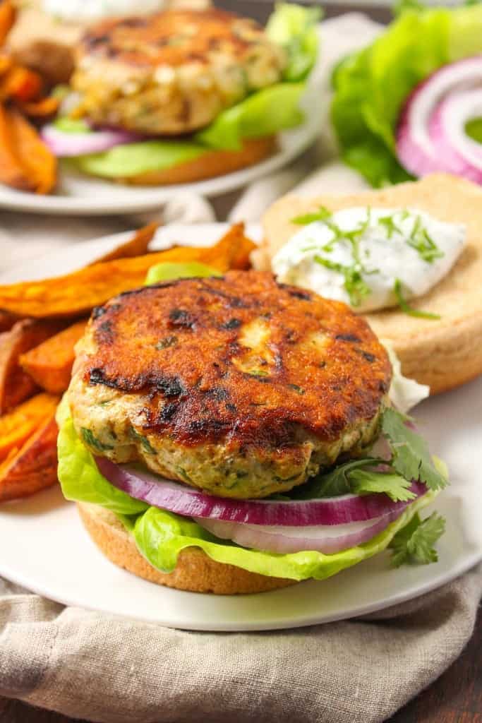 Curry turkey burger on a white plate.