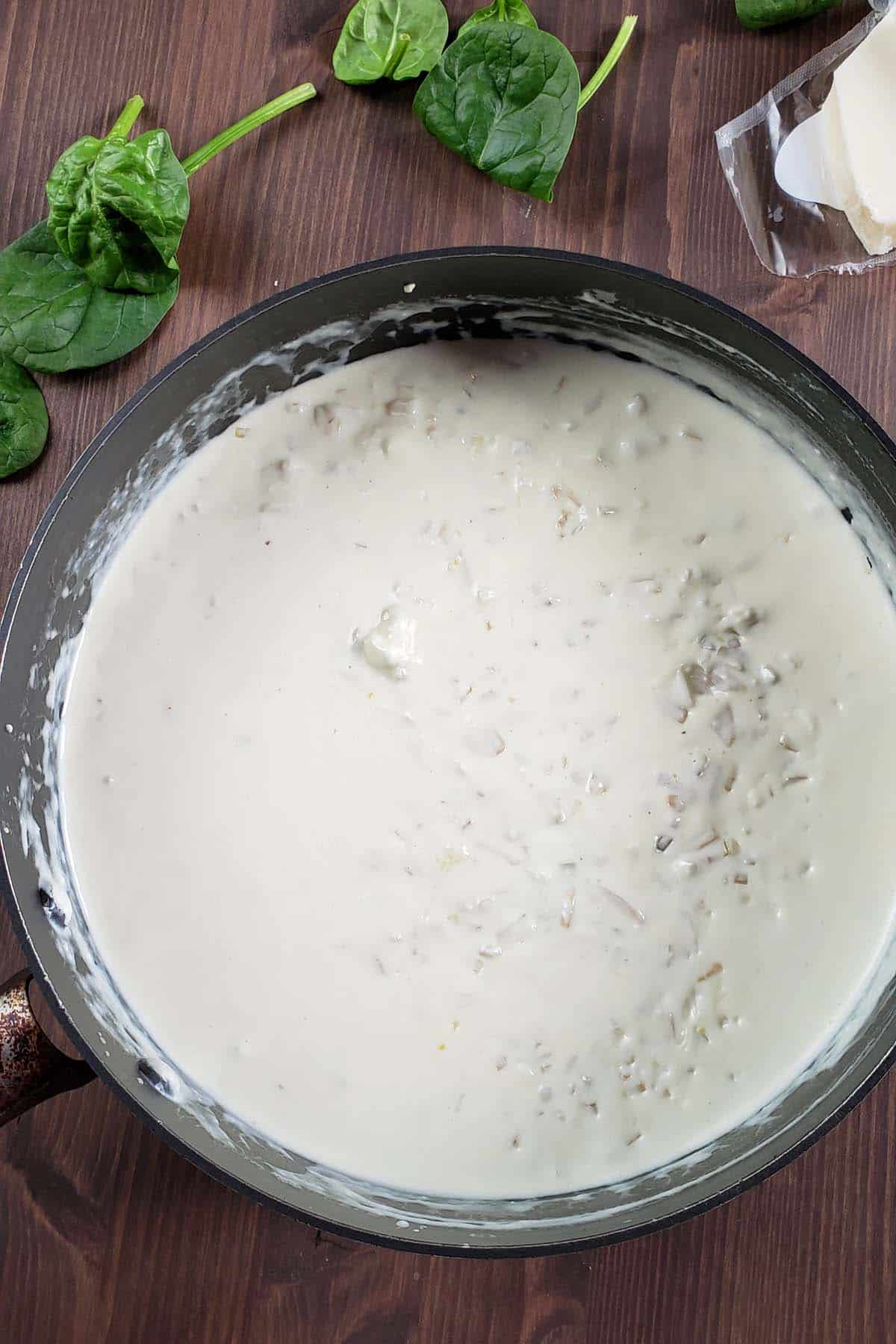 Cream cheese sauce in a sauce pan.