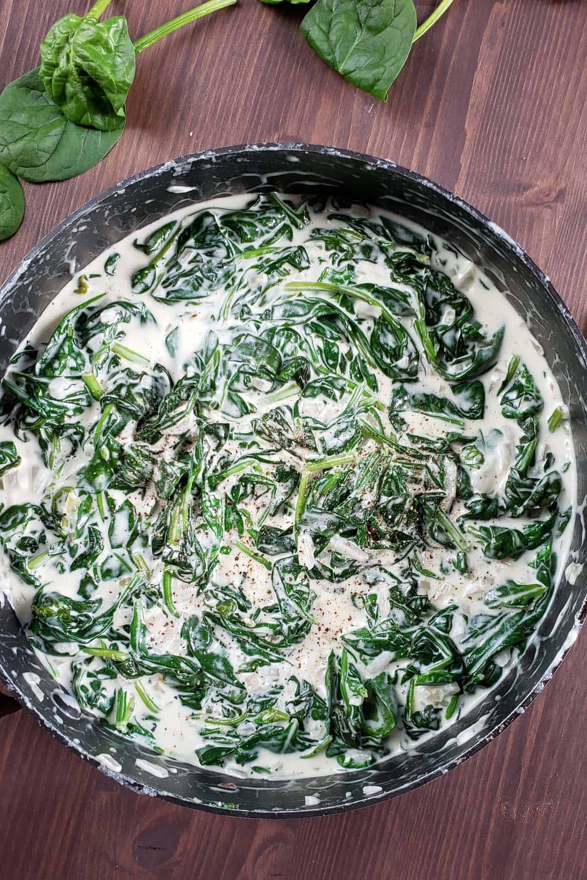 Asiago creamed spinach in a saucepan.