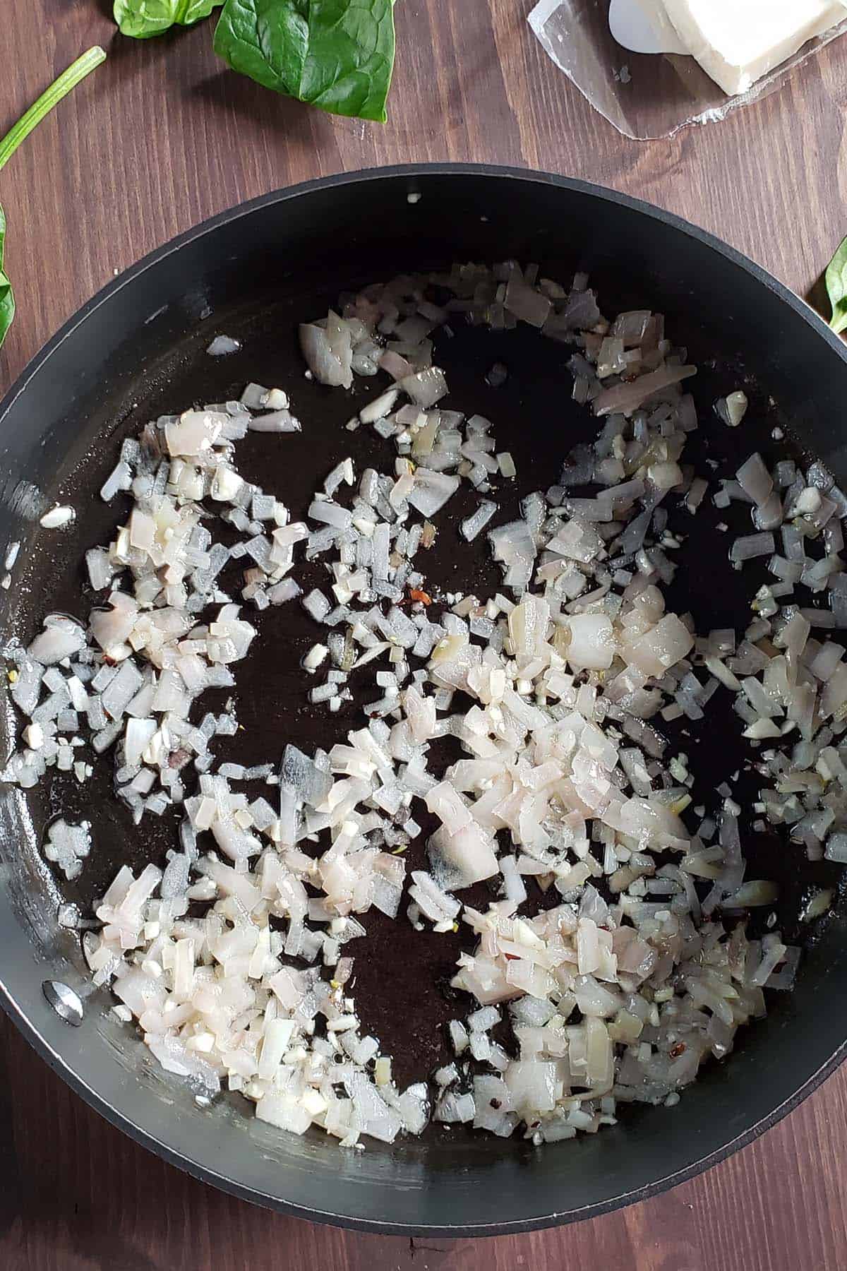 Sauteed shallots in a saucepan.