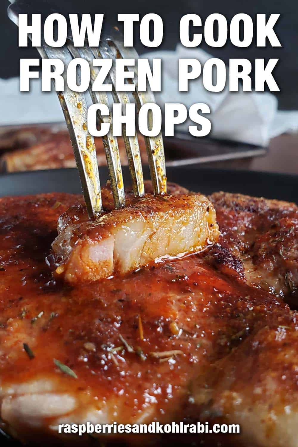Slice of pork chop on a fork.