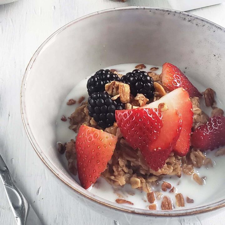 Oatmeal topped with berries in a bowl.