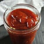 Bbq sauce in a glass jar.