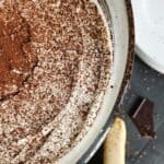 Top down view of tiramisu in a trifle dish.