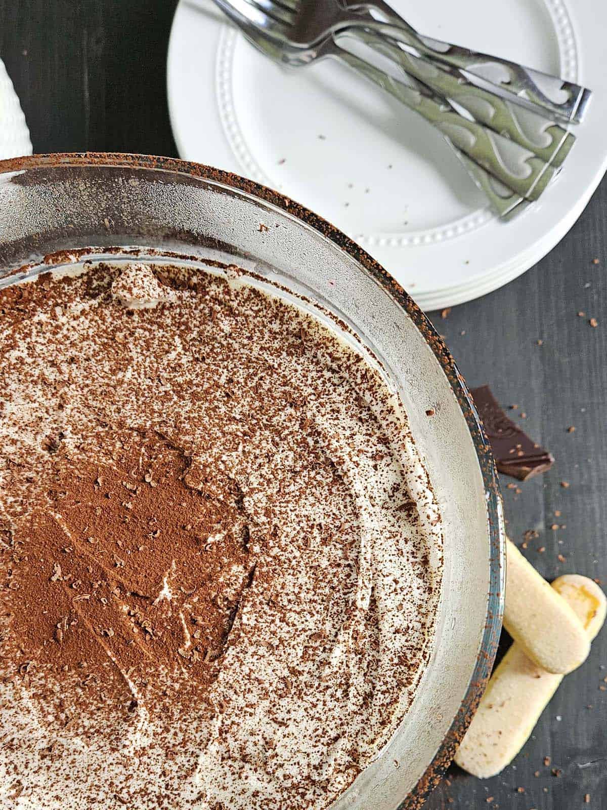 Top down view of tiramisu in a trifle dish.