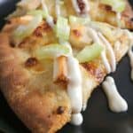 Close up of a slice of buffalo chicken pizza.