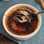 Top down view creme brulee with cracked sugar crust.