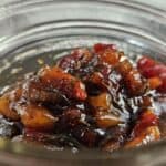 Maple Bacon Onion Jam in a glass jar.