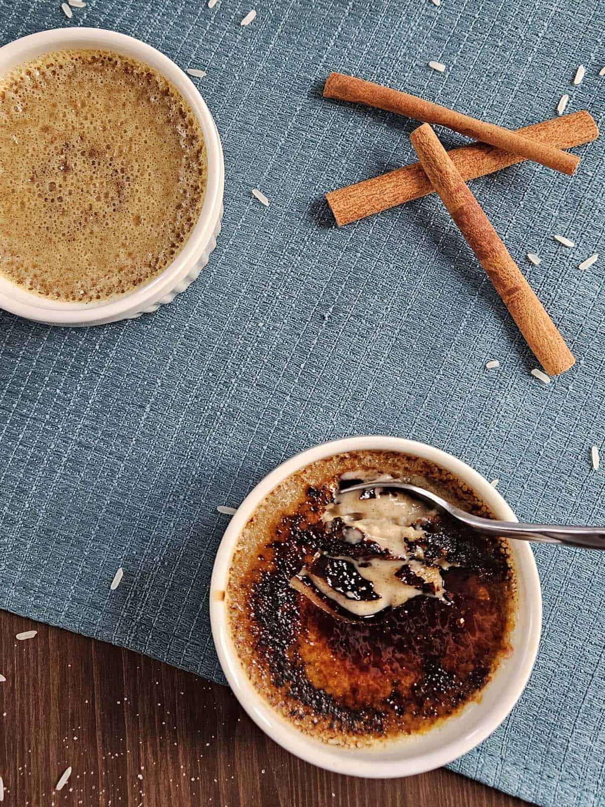 Top down view creme brulee with cracked sugar crust.