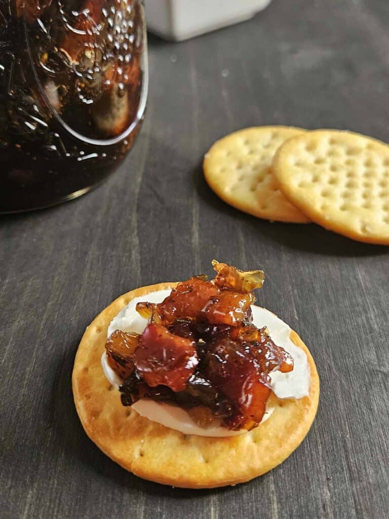 Maple Bacon Onion Jam on top of a cracker.