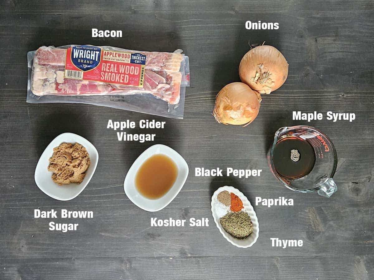 Maple bacon onion jam ingredients on a dark surface.