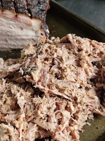 Shredded pork on a baking sheet.