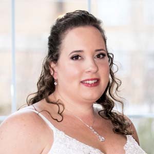 Close up of woman in white dress.