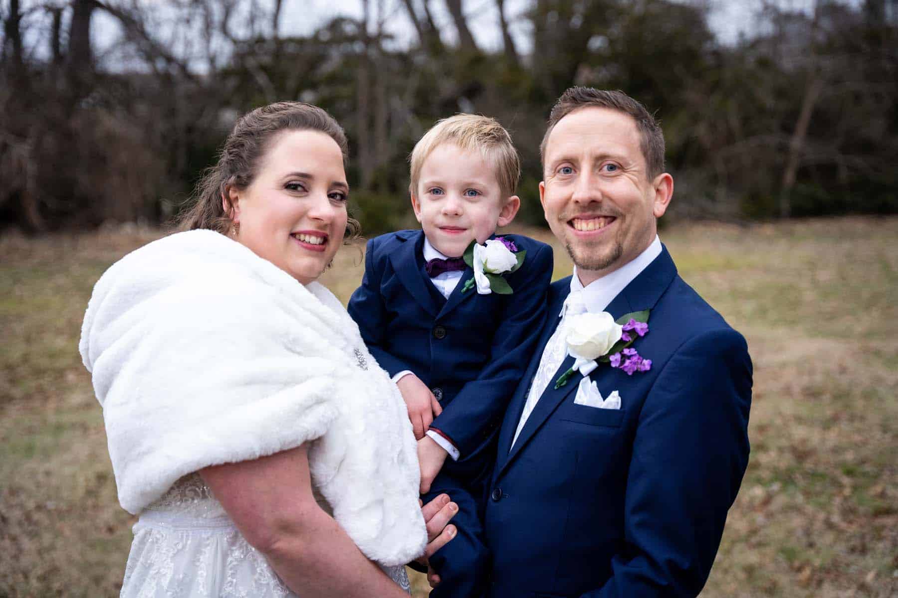 Bride and groom with their 5 year old son.