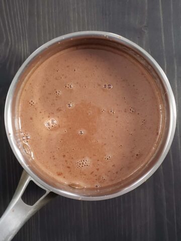 Nutella and heavy cream whisked together in a small saucepan.