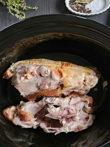 Chicken bones in a slow cooker.