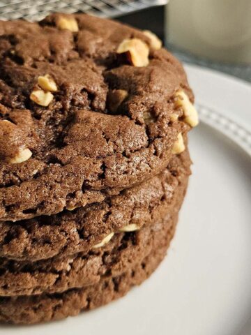 Stack of Sourdough Nutella cookies on a white plate.