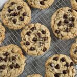 Chocolate chip cookies on a wire rack.